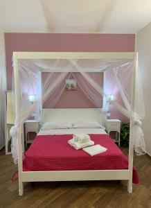Postel nebo postele na pokoji v ubytování All’Anoneto B&B