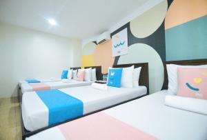 Katil atau katil-katil dalam bilik di Sans Hotel at Rana Cebu