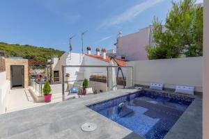 a swimming pool on the roof of a house at Casa del Mar in Tamariu