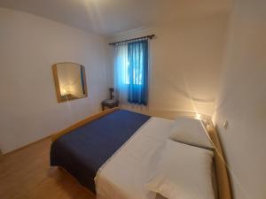 Postel nebo postele na pokoji v ubytování Apartments Elizabeta
