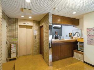 Ο χώρος του λόμπι ή της ρεσεψιόν στο Yonago New Urban Hotel