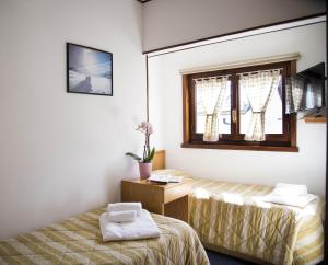 Letto o letti in una camera di Hotel Marguareis