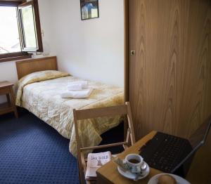 Letto o letti in una camera di Hotel Marguareis