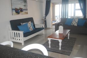 a living room with a couch and a coffee table at 6 Key Largo in Kingsburgh