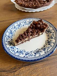 a slice of pie on a blue and white plate at Agriturismo Casale Cerere in Lacedonia +22 photos