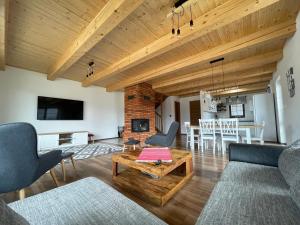 a living room with a couch and a table at Vila Snezienka in Stará Lesná