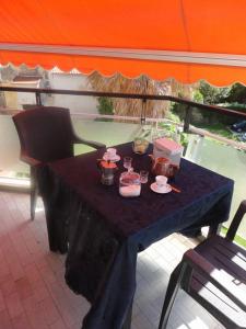 a table with food on it on a balcony at Le Perle in Bordighera