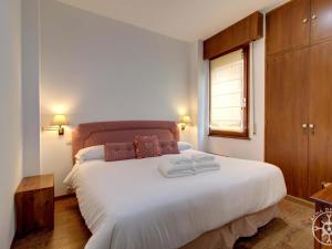 A bed or beds in a room at VUELTA A CASA de Alma de Nieve