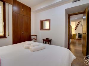 A bed or beds in a room at VUELTA A CASA de Alma de Nieve