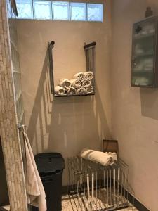 a bathroom with a towel rack and a stair case at Ferienwohnung Villa Wohntraum in Varel