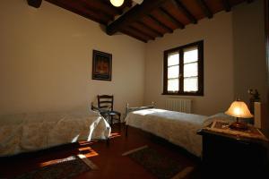 Postel nebo postele na pokoji v ubytování Agriturismo Cortoreggio
