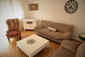 a living room with a couch and a coffee table at Centar in Bijeljina