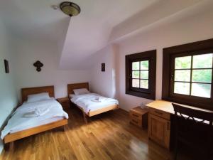 Postel nebo postele na pokoji v ubytování Guest Mansion, Гостински Палат