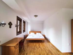 Postel nebo postele na pokoji v ubytování Guest Mansion, Гостински Палат