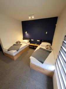 En eller flere senge i et værelse på Motel Bihać