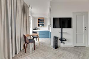 TV a/nebo společenská místnost v ubytování Comfort Apartments Granaria