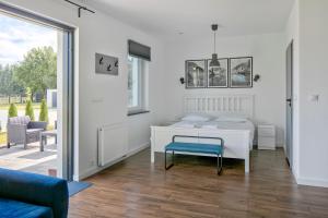 Posteľ alebo postele v izbe v ubytovaní Apartamenty Zielona Lipka