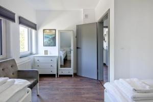 Posteľ alebo postele v izbe v ubytovaní Apartamenty Zielona Lipka