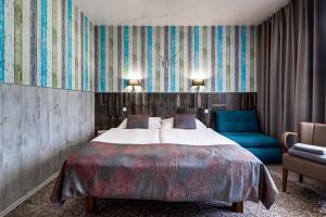 Posteľ alebo postele v izbe v ubytovaní Royal Court Hotel