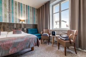 Posteľ alebo postele v izbe v ubytovaní Royal Court Hotel
