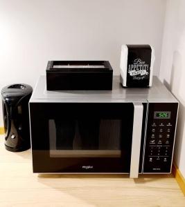 a microwave oven sitting on top of a counter at La cave de Nana in Liège