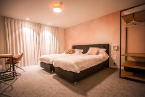 Postel nebo postele na pokoji v ubytování Hotel - B&B Elementum