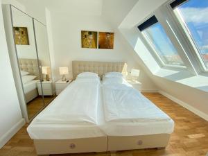 Posteľ alebo postele v izbe v ubytovaní Steiner Residences Vienna Nestroyplatz