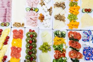 a collage of different types of vegetables and cheese at Petit Palace Plaza España in Madrid