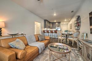 a living room with a couch and a table at Single-Story Condo Less Than 1 Mile From Downtown! in Fredericksburg