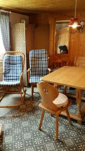 a room with a table and two chairs and a table at Landhaus Eifel in Demerath