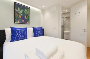 En eller flere senger på et rom på Earls Court West Serviced Apartments by Concept Apartments