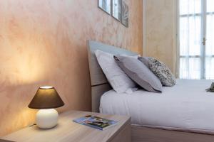 Posteľ alebo postele v izbe v ubytovaní Casa Cavour a pochi passi da Piazza San Carlo