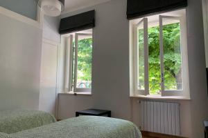 A bed or beds in a room at Il Villino in città