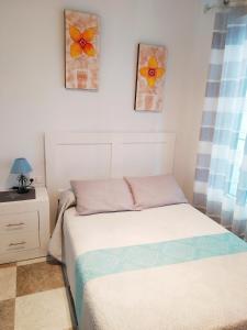 Ein Bett oder Betten in einem Zimmer der Unterkunft Apartamento Carvajal Beach
