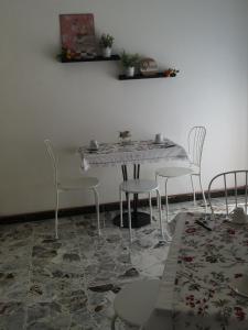 a dining room with a table and chairs at Azzurramare Bed & Breakfast in Grottammare +19 photos