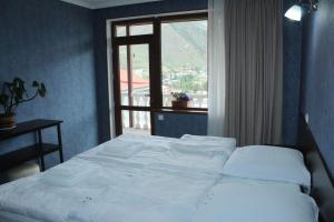 Кровать или кровати в номере Roza Guesthouse