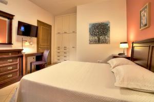 Posteľ alebo postele v izbe v ubytovaní Marini Luxury Apartments and Suites
