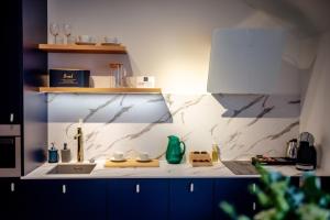 Kuchnia lub aneks kuchenny w obiekcie Apartamenty Stare Miasto Zamość, Prywatny Parking, Winda