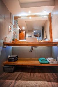 a bathroom with a sink and a mirror at Departamento SUR in Ushuaia