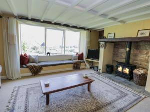 a living room with a couch and a fireplace at Dale View in Whitby