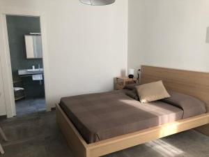 a bedroom with a bed in a room at Verde Matematico in Vico del Gargano
