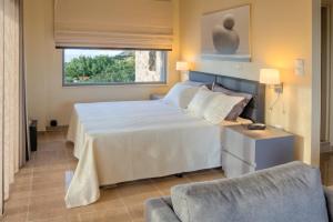 Posteľ alebo postele v izbe v ubytovaní Marini Luxury Apartments and Suites