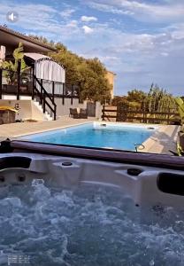 a swimming pool in a backyard with a swimming pool at Au bien être in Bastia