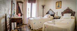 Posteľ alebo postele v izbe v ubytovaní Casa Rural La CasAna