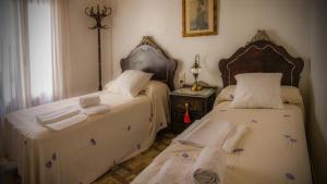 Posteľ alebo postele v izbe v ubytovaní Casa Rural La CasAna