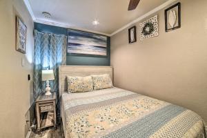 a small bedroom with a bed and a window at Updated Front Beach Condo w/ Resort Amenities! in Corpus Christi +21 photos