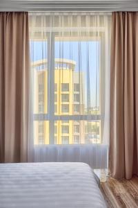 Imagen de la galería de RAISSON APARTHOTEL B104 Хан Шатыр, en Astana