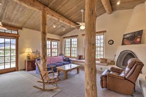 a living room filled with furniture and a fireplace at Bright Prescott Studio with Thumb Butte Views! in Prescott