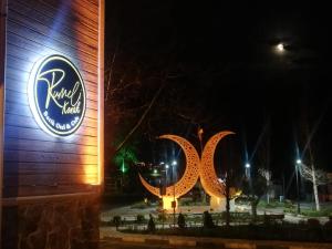 a sign for the raffles hotel at night at Rumeli Konak Butik Otel in Tekirdağ