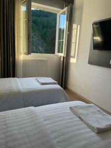Ένα ή περισσότερα κρεβάτια σε δωμάτιο στο Hotel SH & SH